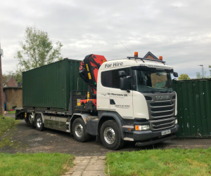 Building site moves lorry with container